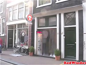 Amsterdam prostitute fellates customer